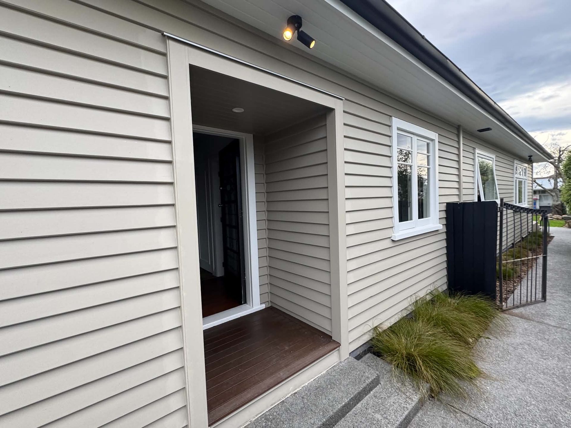 Cream weatherboard house entry freshly painted
